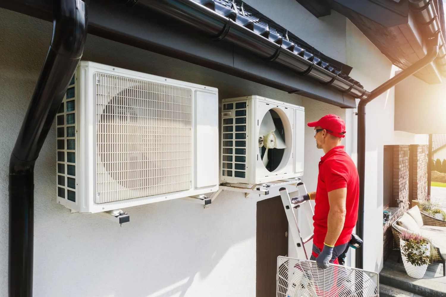 HVAC technician servicing an outdoor AC unit